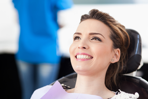 happy woman in dental chair